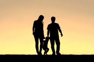 Silhouette of Family of Three People Walking at Sunset